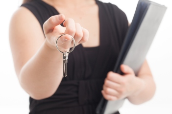 Woman handing over keys